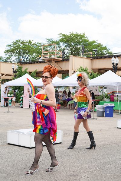 Drag queens dressed in rainbow clothing